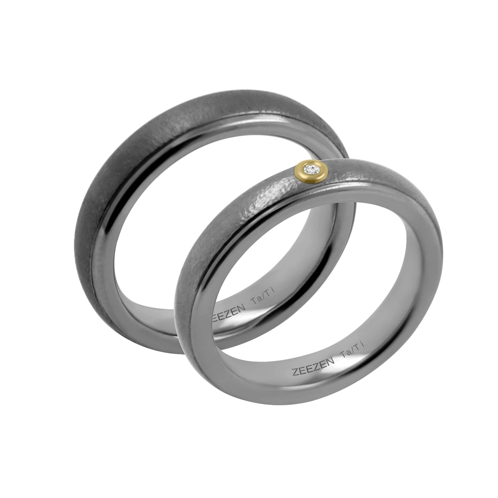 Titan Ring w/ Tantalum Fine Hammered Mat/Polished. Ring profile: width: 5.0 mm || height: 2.7 mm. Titan ring next to matching couple ring with a white lab grown diamond and 18k yellow gold