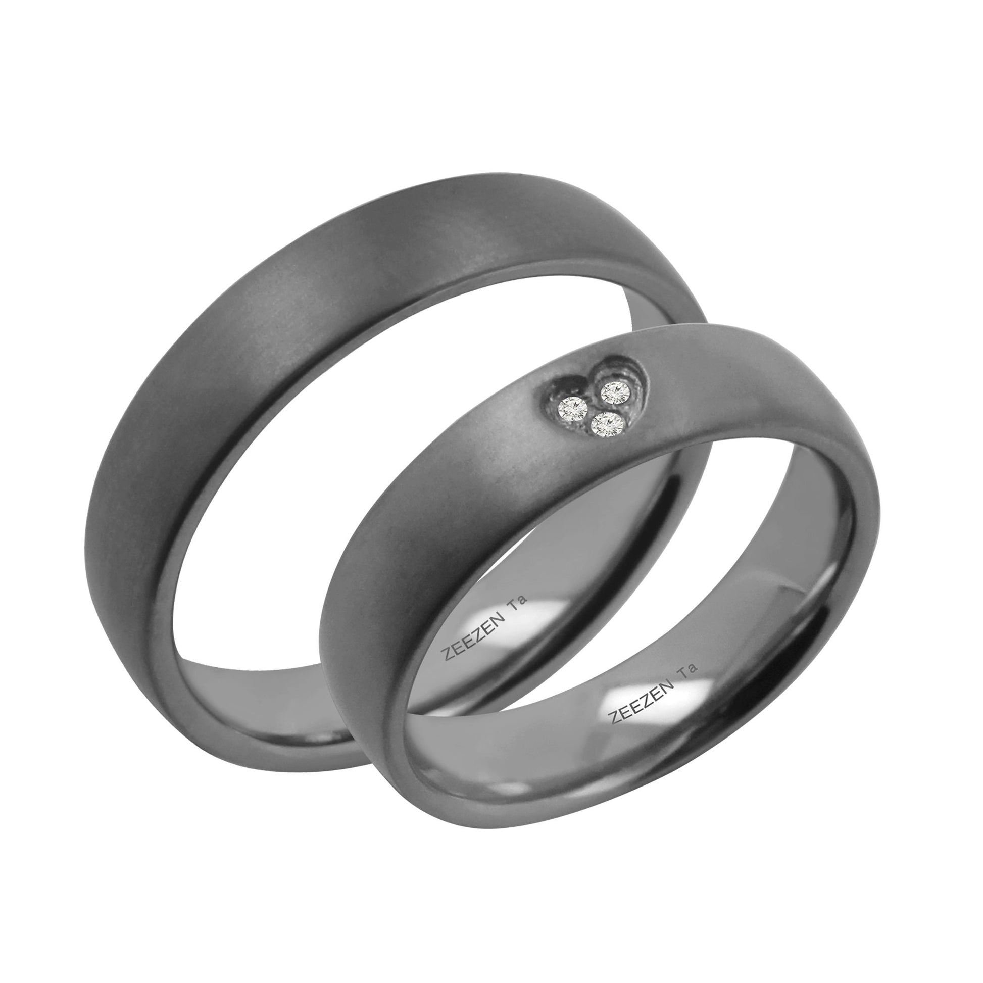 Tantalum Ring w/o min. Matte Ring profile: width: 5.0 mm || height: 1.8 mm. Matt tantalum ring. Next to a matching couple ring that has a heart shaped hole in the center with three lab grown diamonds in it.